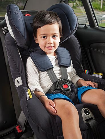 Child safely seated in a child restraint
