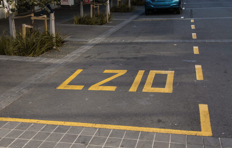 LZ10 painted in yellow in a car parking space